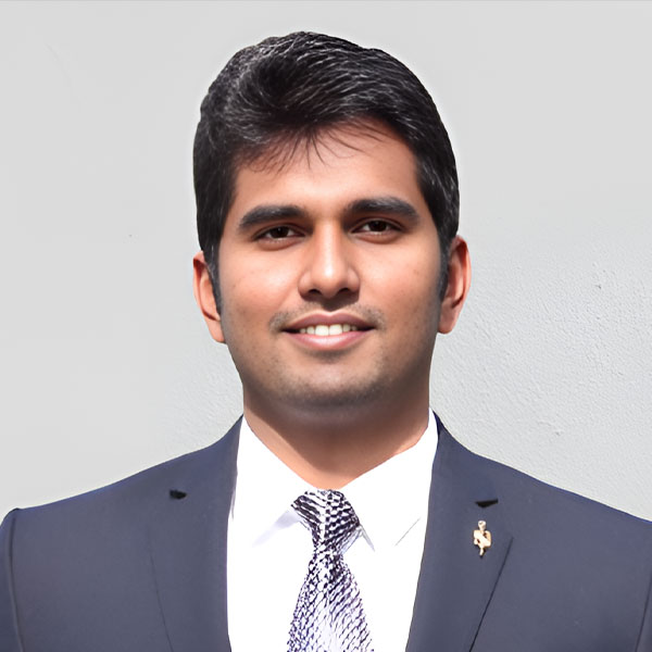 Students working at desk together drinking coffee