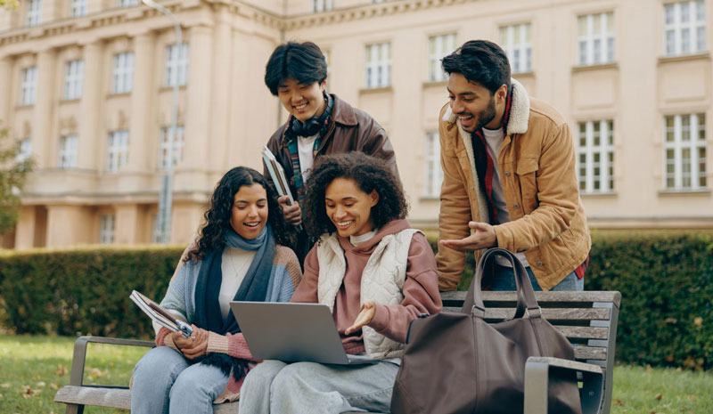 Person walking down a street with cloud shaped street lights above